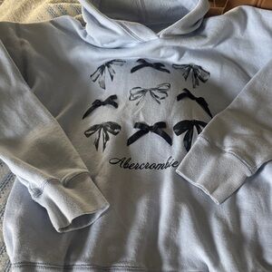abercrombie kids Pale Blue Pullover Hoodie with Black Bow Detail. Size 11/12.